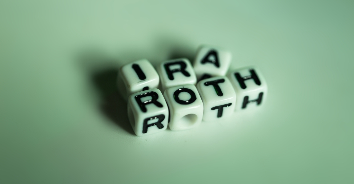 ira and roth written on dice box