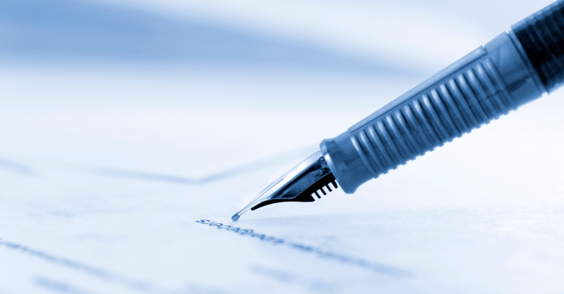 pen writing on a paper