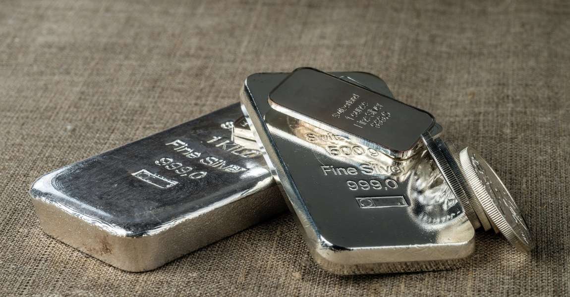 silver bars stacked with each other