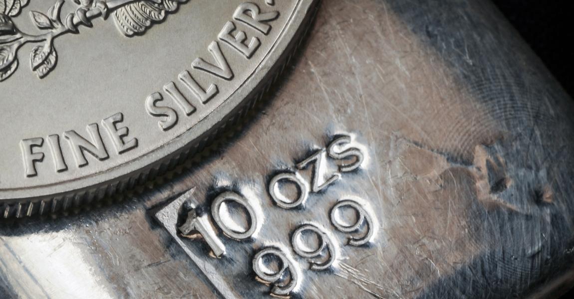silver coin and a bullion bar