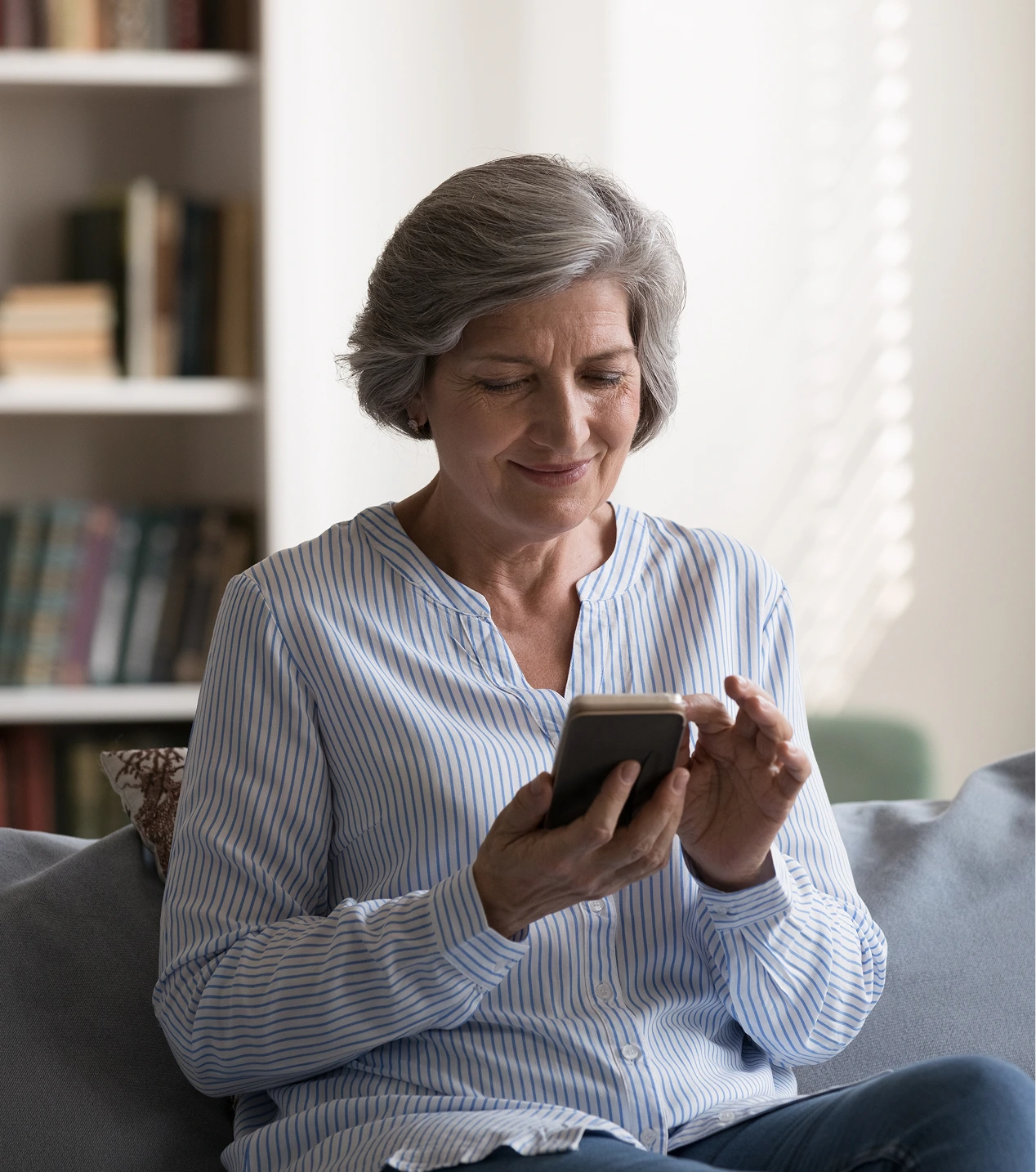 A old woman using a phone