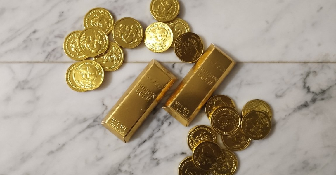 various gold bars and gold coins