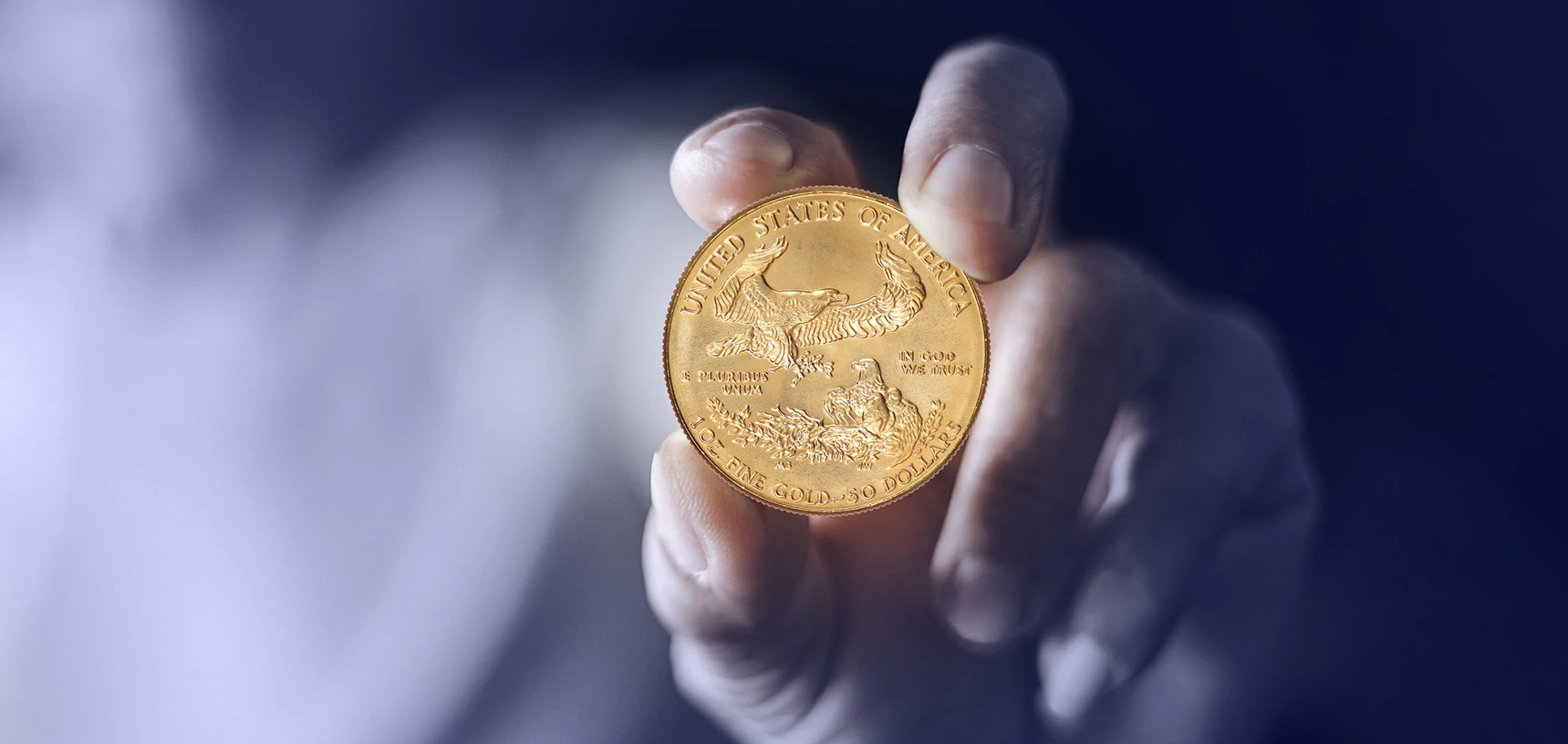 A close up shot of holding us gold coin