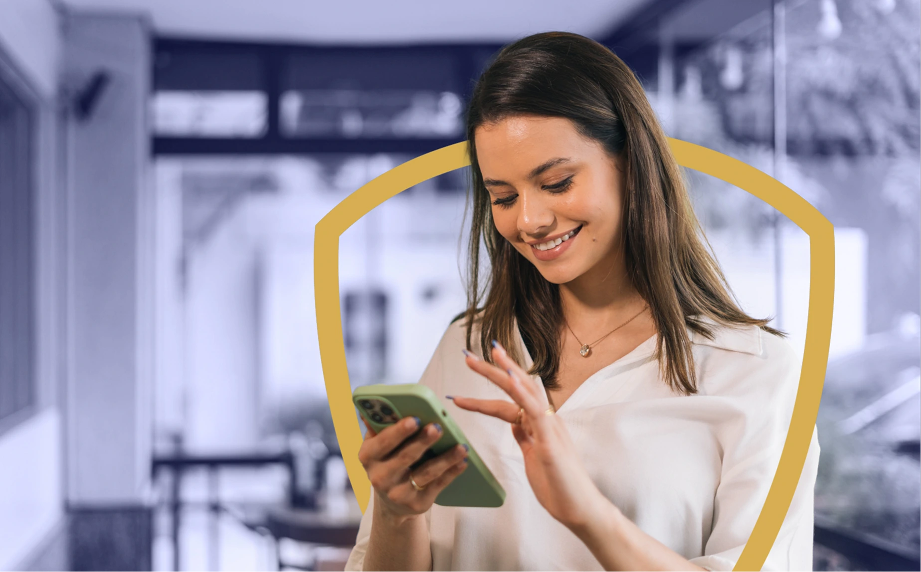 A woman using a phone, surrounded by a shield shape