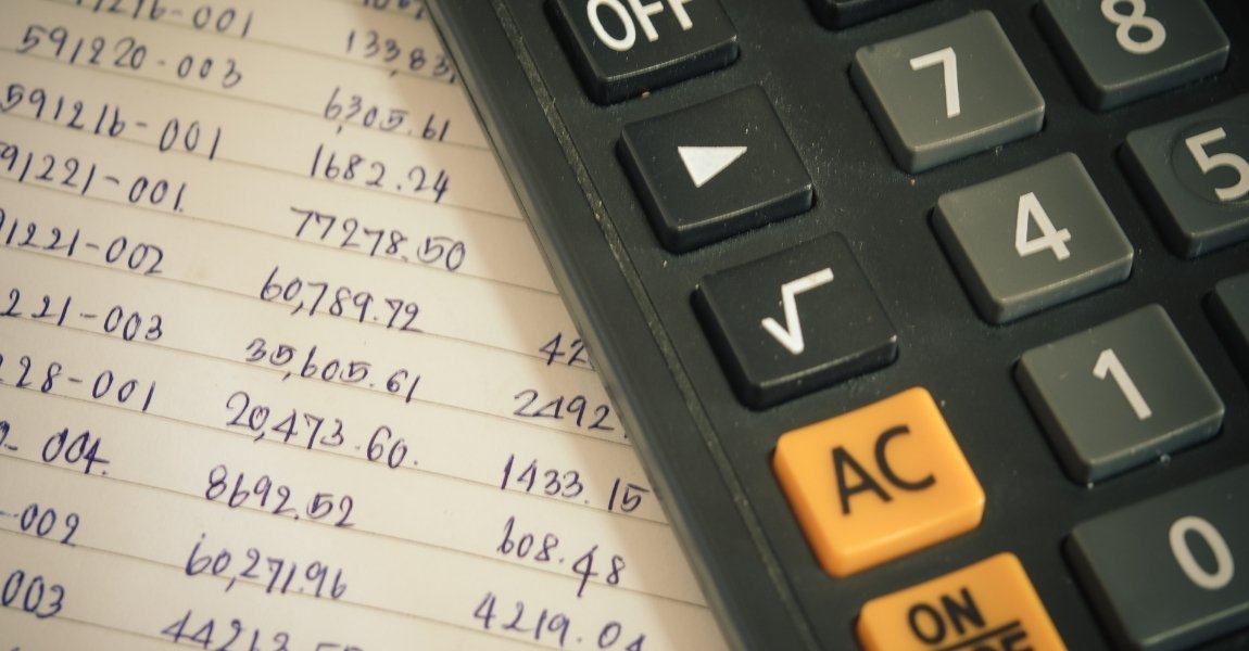 calculator on top of number notes