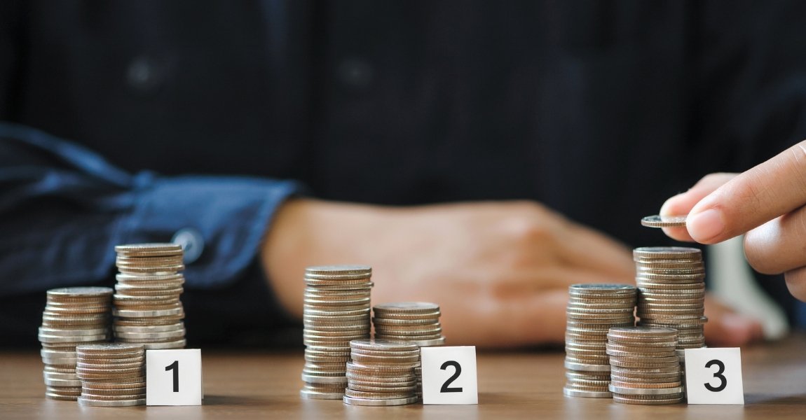 three different stack of coins