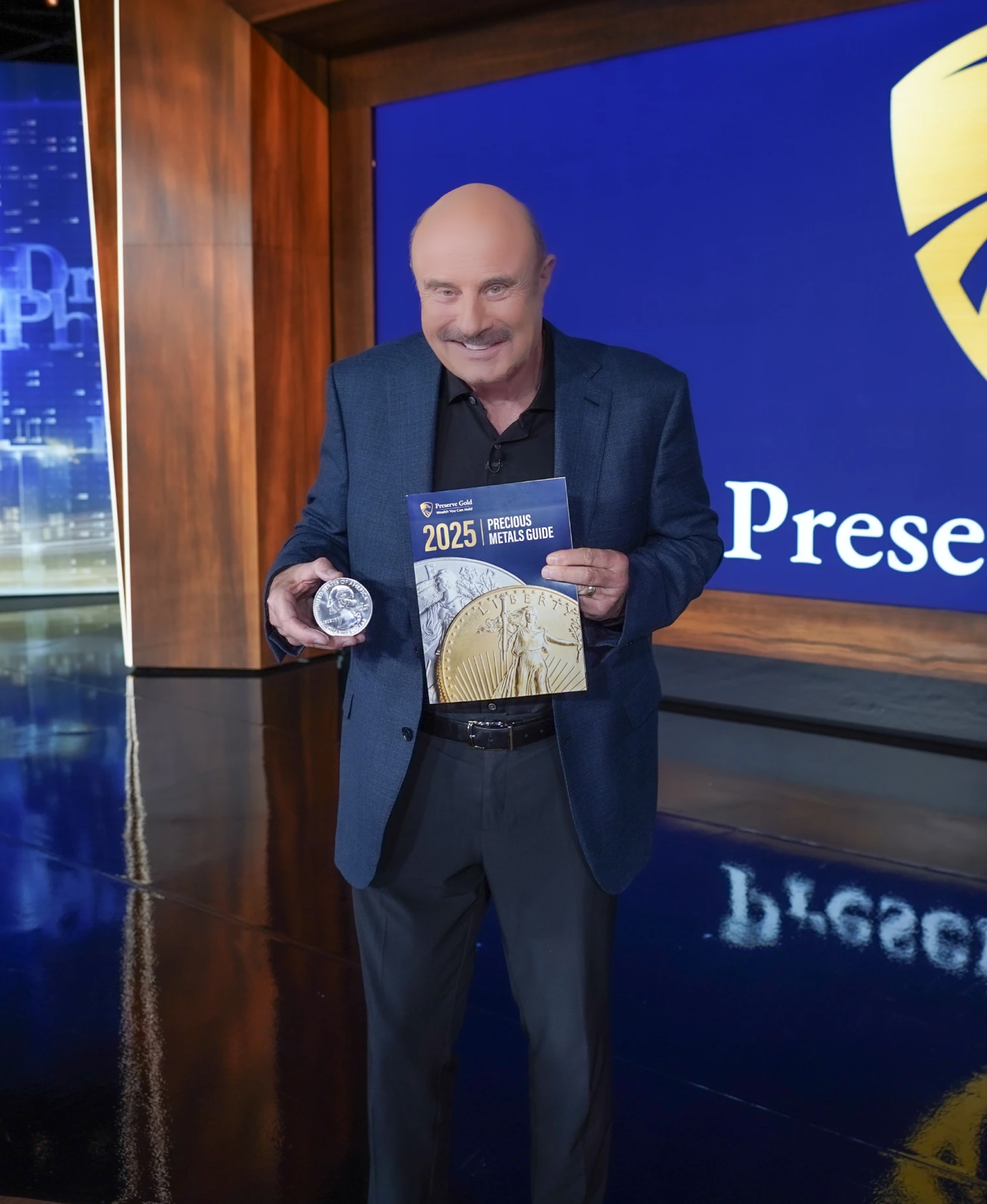 Dr. Phil holding preserve gold products
