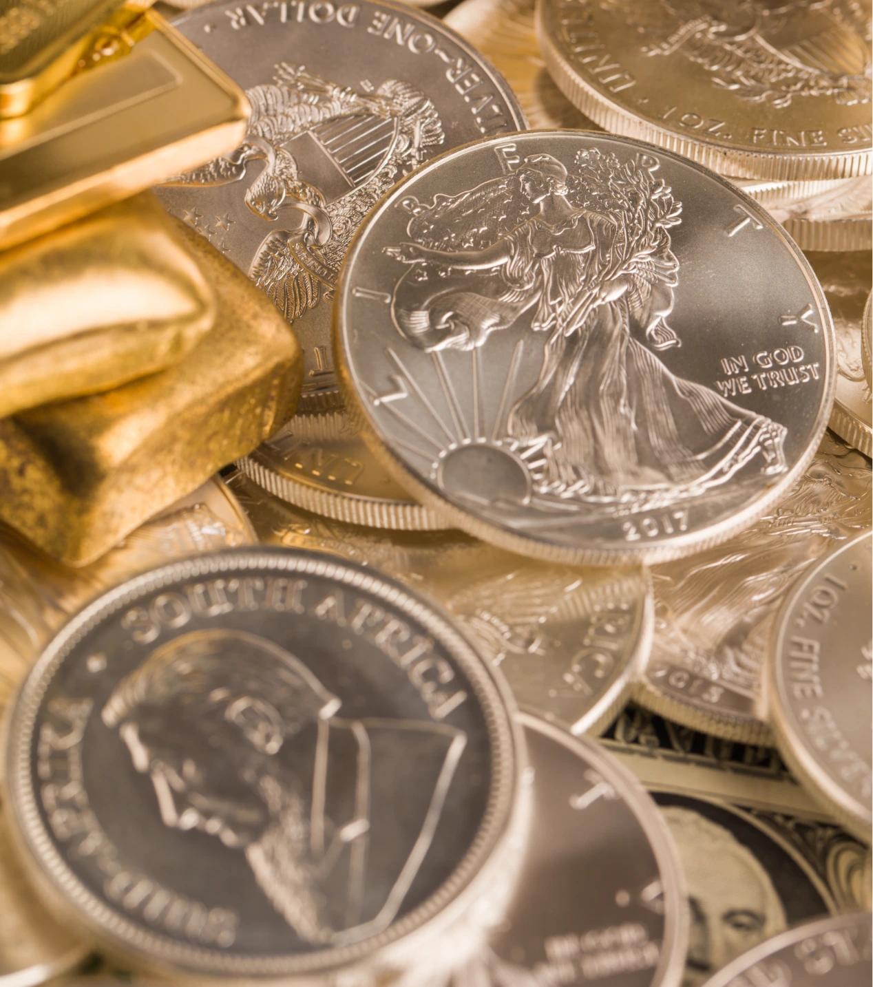 Silver and gold bullion on the table